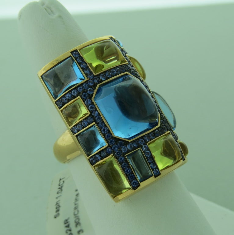 Modern 18k gold ring. Sapphires approx. 1.04ctw, citrine - approx. 5.86ctw, topaz - approx. 13.3ctw. Ring size 6 1/2, ring top is 30mm x 22mm. weight - 19.7gr