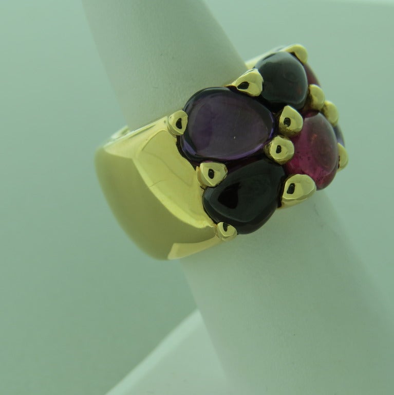 New Pomellato 18k gold ring from Sassi collection,retails for $8920. Set with amethyst,rhodolite and garnet cabochons. Ring size is 7, ring is 15mm wide. weight - 31.1gr