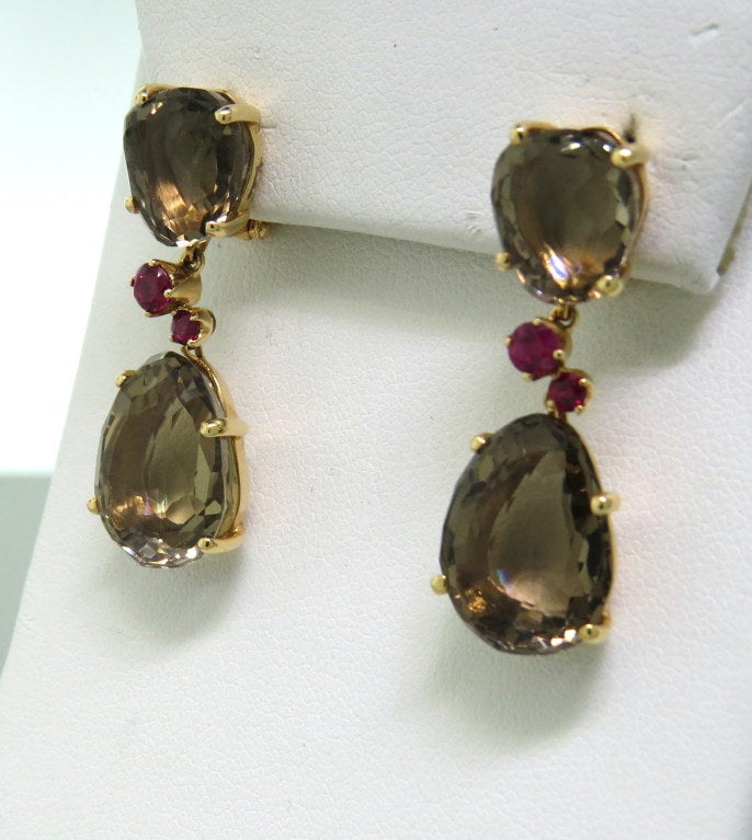 New Pomellato Bahia 18k rose gold earrings with smokey quartz and rubies. Earrings are 35mm x 12mm. weight - 13.gr