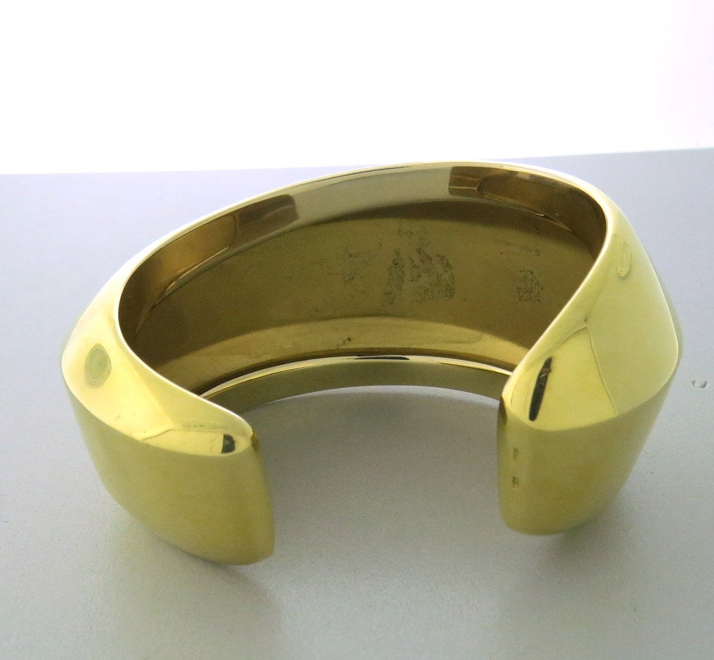 New Pomellato 18k yellow gold large cuff bracelet. Will fit up to 7