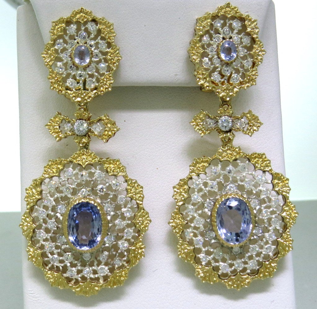 Earrings with diamonds and sapphires. measurements: total length 63mm long, bottom: 30mm X 28mm. Accompanied with original box and original paperwork with retail evaluation for $89,500.00