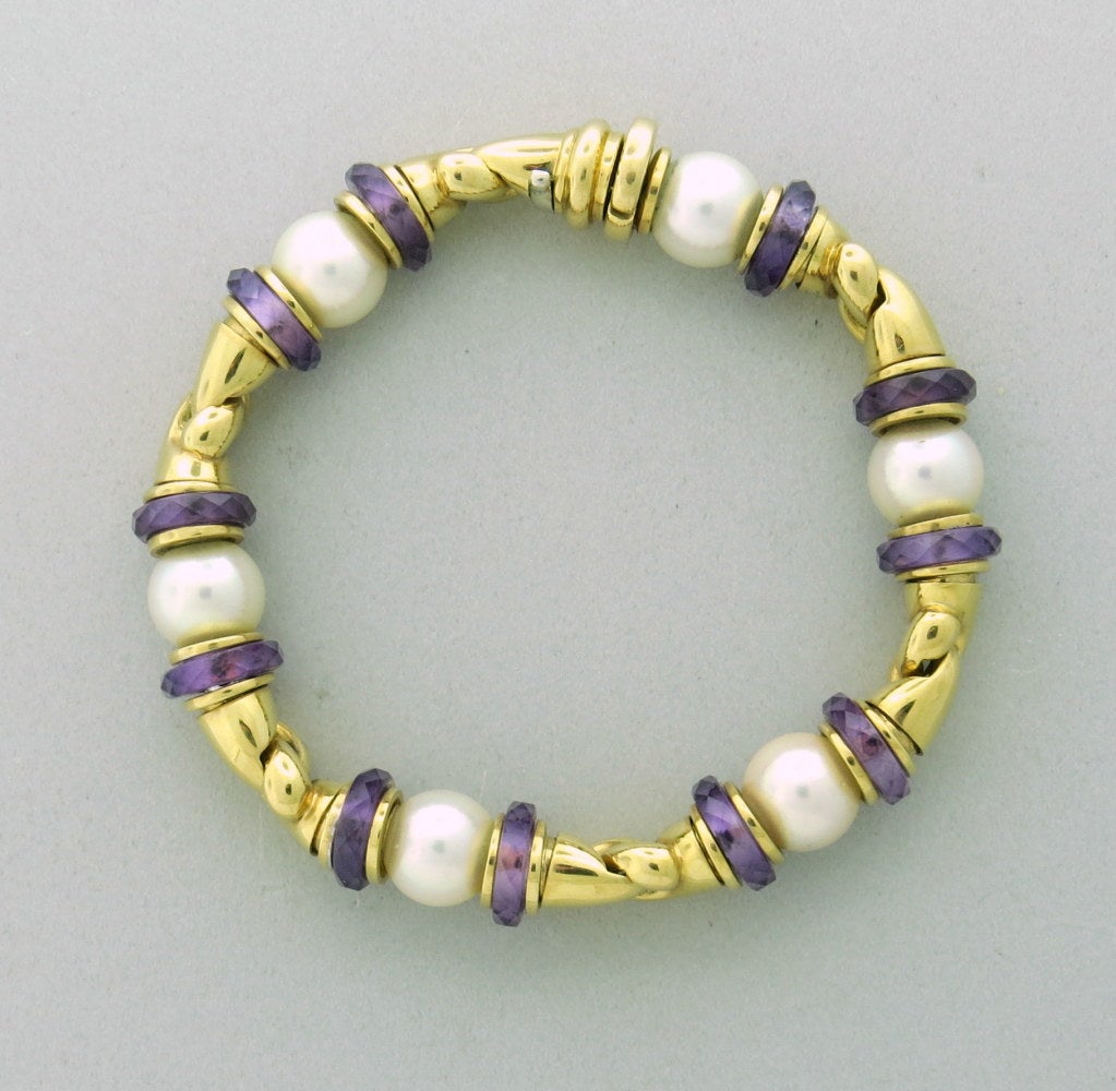 18k yellow gold, 
cultured salt water south sea pearls 9.3mm in diameter. faceted amethyst spacers. 
7 1/8
