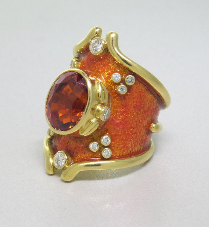 18k yellow gold,  enamel, oval mandarin garnet -7.64ct, diamonds approx. 0.50ctw. top of the ring 30mm at widest point.
 finger size-6 1/2.