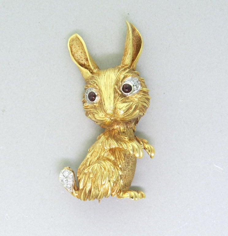 Vintage Tiffany & Co 18k yellow gold rabbit brooch with diamonds and garnet.Diamonds are approx. 0.14ctw.  Brooch is 54mm x 22mm. Marked - Tiffany,18k. weight - 28.3gr