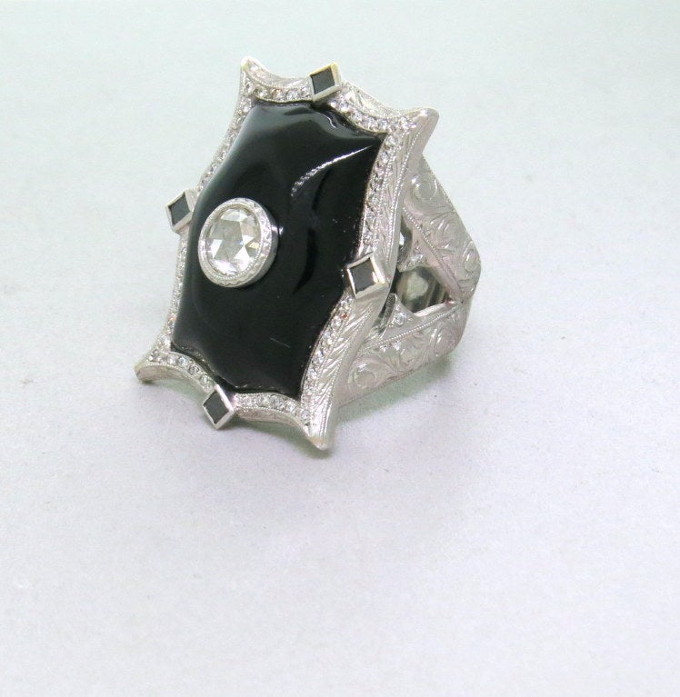 18k white gold top of the ring 31mm X 25mm decorated with diamonds and black onyx. ring size - 8 1/2, weight- 31.4g