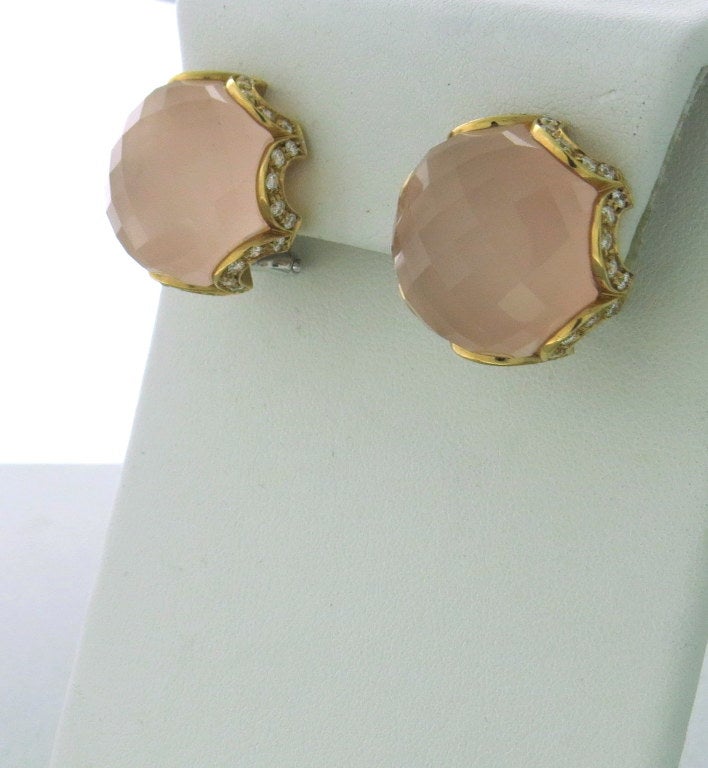 18k yellow gold, diamonds approximately 0.70ctw , faceted rose quartz. 
20mm in diameter. 
Weight- 17.5g.