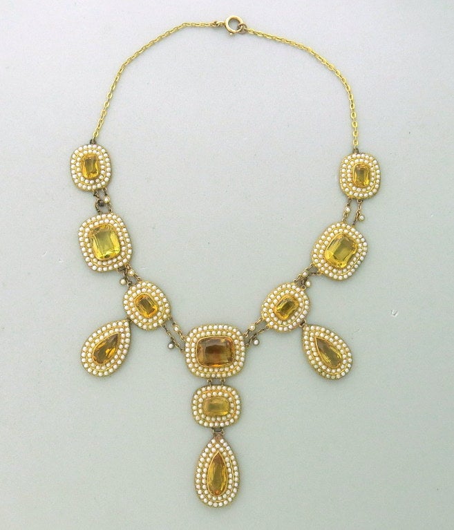 9k Yellow Gold, bezel set faceted vitrines surrounded by seed pearls. 14 1/2