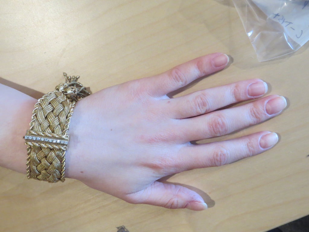 Mid century 14k gold wide woven bracelet with approx. 0.33ctw VS/G diamonds. Bracelet will fit up to 6 7/8