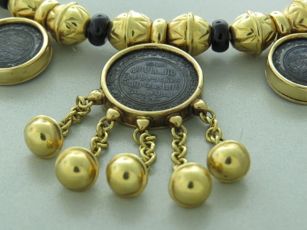 Marina B 18k gold necklace with 7 coins and onyx spacers from Bedouin collection. Necklace is16