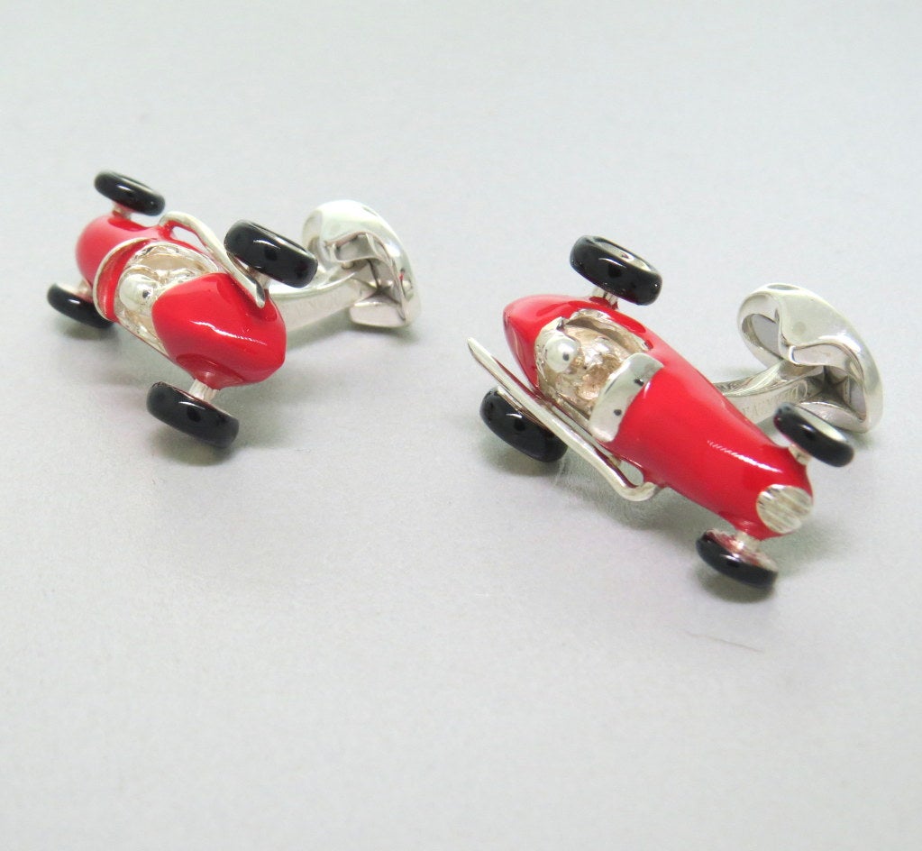 New Deakin & Francis sterling silver red racing car with black wheels. Car is 30mm x 16mm. Come with original box and papers. Marked - Deakin & Francis,D & F,925. weight - 31.5g