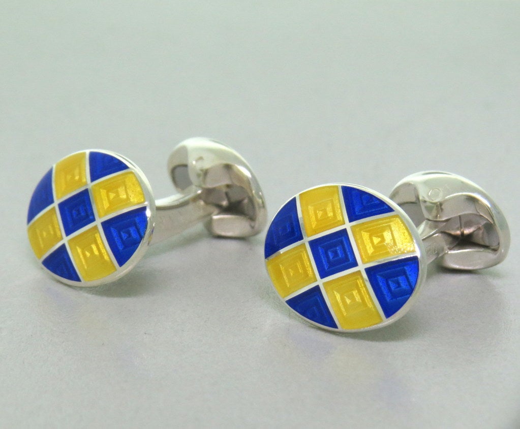 Brand new Deakin & Francis sterling silver oval cufflinks,decorated with royal blue and bright yellow enamel. Cufflink top 19mm x 14mm. marked Deakin & Francis,D & F,925. weight - 16.2g Come with box and papers