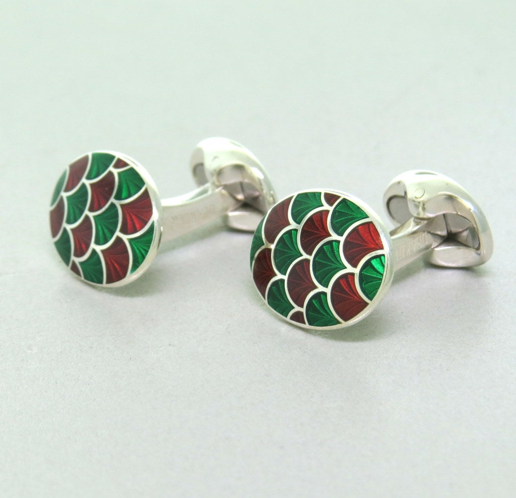 Brand new Deakin & Francis sterling silver oval cufflinks,decorated with green and maroon enamel. Cufflink top is 19mm x 14mm. Marked D & F,925,Deakin & Francis. Come with box and papers. weight - 16.5g