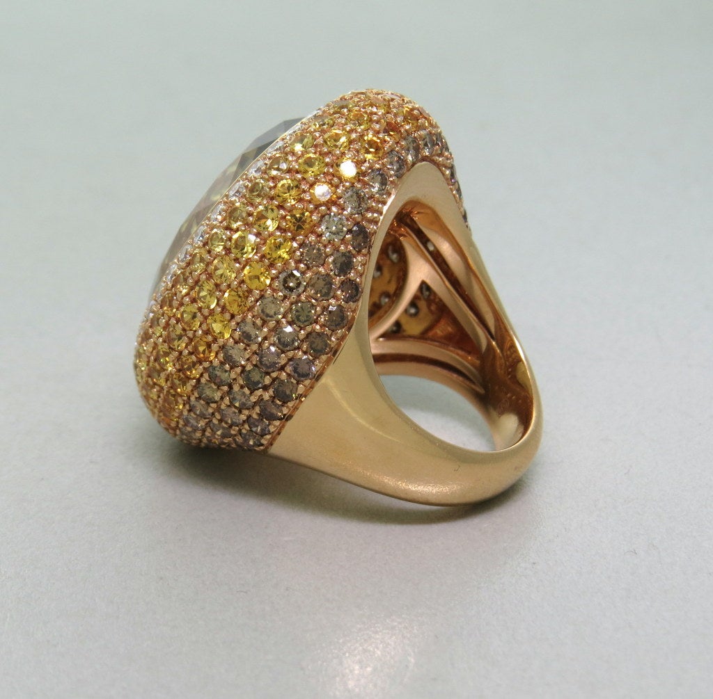 Large 18k gold ring with approx. 4.00ctw white and fancy diamonds and 5.00ctw yellow sapphires, surrounding 26ct faceted citrine. Ring size - 6 1/2, ring top is 34mm x 27mm. weight - 29.9g