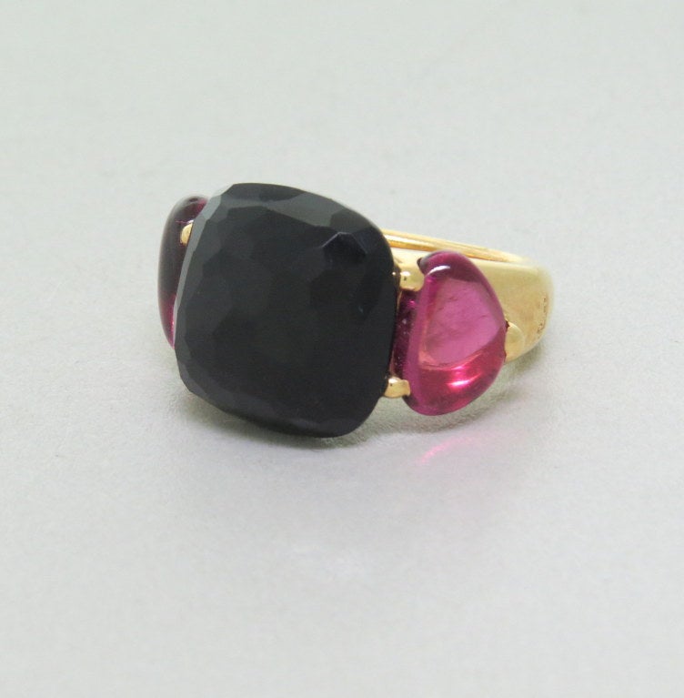 Pomellato 18k rose gold ring from Capri collection with faceted onyx and pink tourmaline cabochon side stones.Retail approx. $8770.  Ring size - 6 1/2, ring top is 15mm x 24mm. Marked - Pomellato,750. weight - 16.1g
