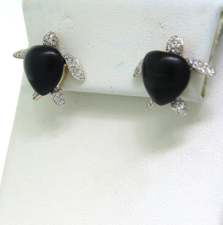 18k gold stud earrings by Vhernier, featuring black stone and diamond adorned turtles. Earrings measure 16mm x 20mm. Marked Vhernier,750,22P. Weight - 9.7 grams