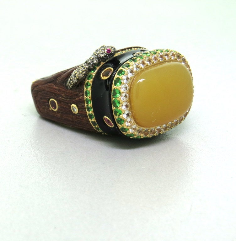 Impressive unusual large 18k gold and wood ring, with diamonds,multi color sapphires and green garnet. Ring size 7, ring top is 19mm x 25mm. Ring sits approx. 20mm from the finger. weight - 27.9g