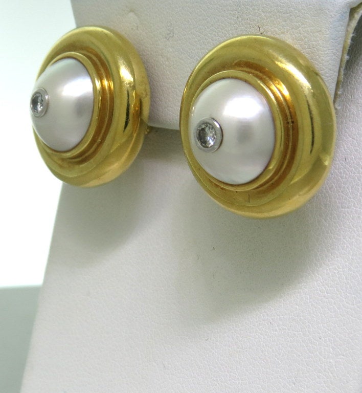 1980s Paloma Picasso 18k yellow gold earrings with 13mm South Sea pearls and approx. 0.25ctw G/VS diamonds. Earrings are 23mm in diameter. Marked - Paloma Picasso,18k,1980,T & Co. weight - 27.2g