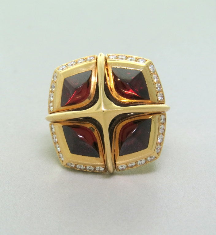 Large 18k gold Valente ring with 0.80ctw diamonds and garnet.Ring size - 7, ring top is 25mm x 25mm. marked - Valente,750. weight - 24.1g