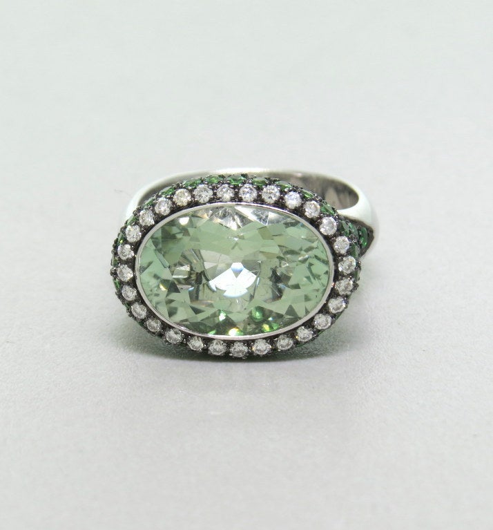 Modern 18k white gold ring with 5ct green amethyst,measuring 9mm x 13m, approx. 0.35ctw GH/VS diamonds and 2.00ctw tsavorite gemstones. Ring size - 6 1/4, ring top is 13mm x 17mm. weight - 9.8g