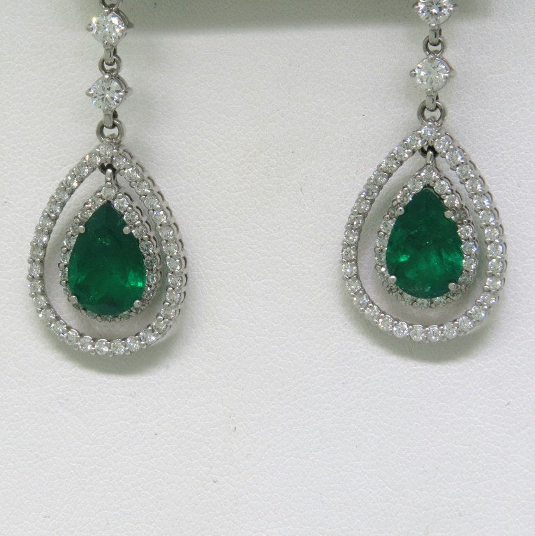 Long drop 14k white gold earrings with 2 natural emeralds with approx.  total weight of 7.50ctw and diamonds - approx. 2.11ctw. Earrings ae 51mm long x 17mm at widest point. weight - 9.9g Earrings come with EGL certificate.