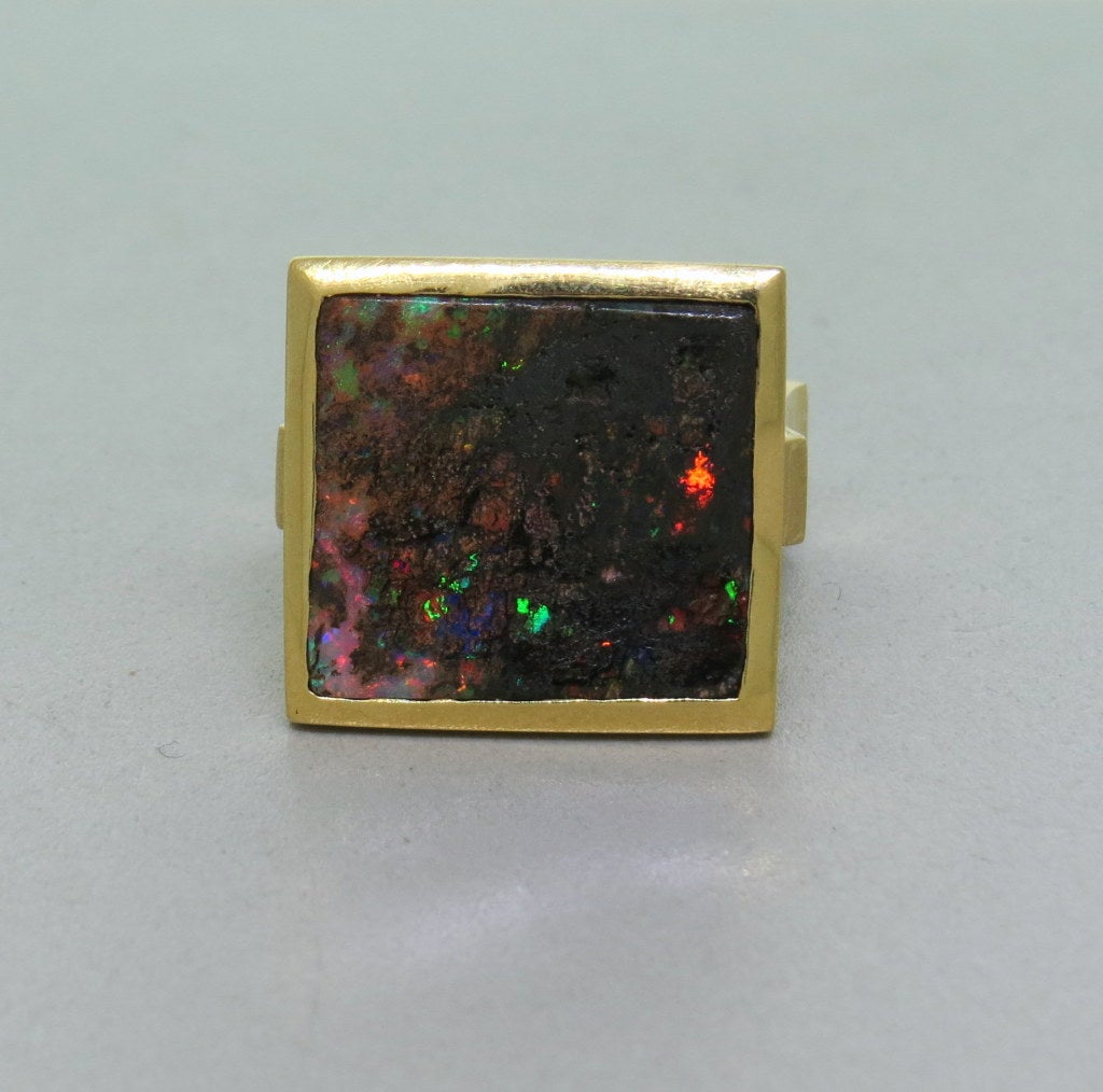 Matte finish 18k yellow gold, setting holding square cut opal, set with 3 diamonds on the back of the shank. top of the ring 19.8mm X 21mm. Finger size -9. weight- 20.8g