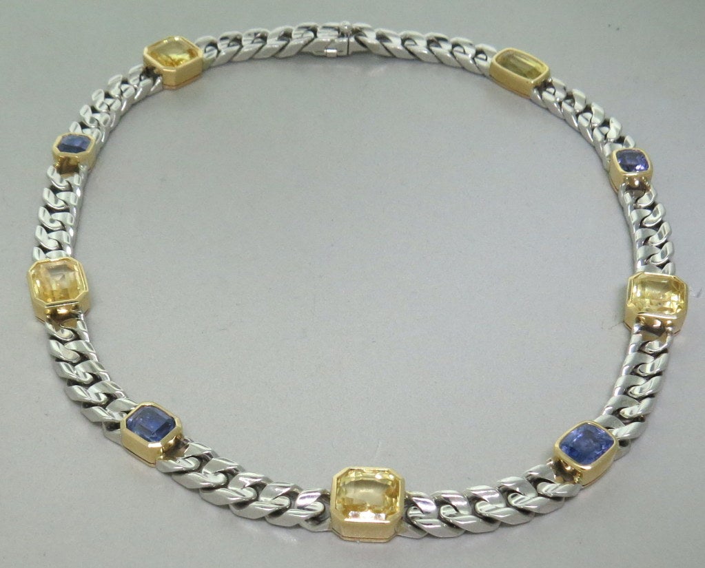 classic white gold link decorated with Yellow gold bezels set with approx. 14ctw yellow and approx. 6ctw blue sapphires . Weight: 84.7g, 14 3/4