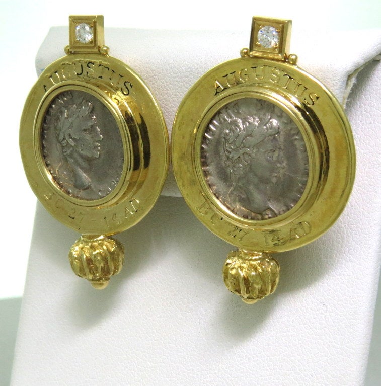 Large 18k gold earrings by Elizabeth Gage with ancient coins and diamonds. Earrings are 43mm x 28mm. Coins  - approx. 16mm in diameter. Earrings are signed Augustus BC 27 - 14 AD. Marked Gage,english gold marks. weight  - 35.5g