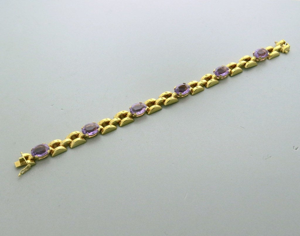 1960s H Stern 18k yellow gold link bracelet with amethyst gemstones. Bracelet is 7