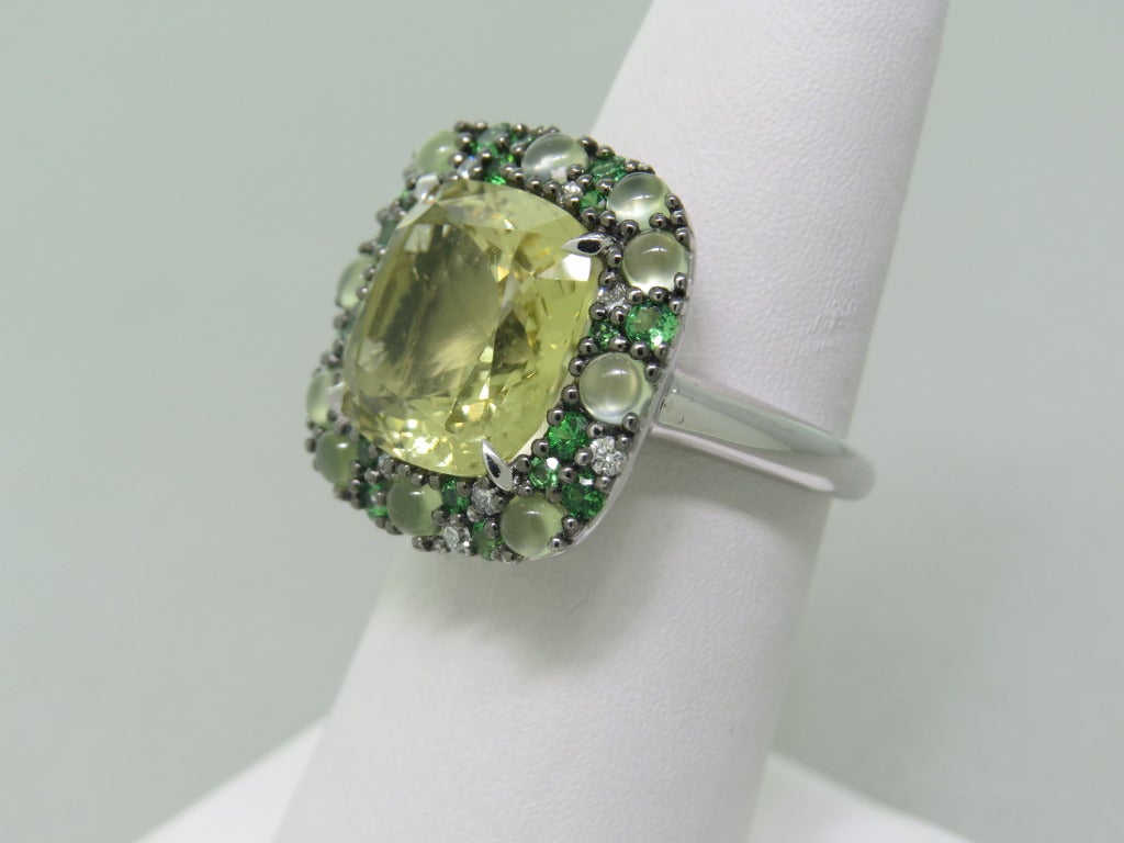 18k white gold ring with 0.57ctw tsavorite and 7.20ct lemon quartz - 13mm x 12mm. Ring size 6 1/2, ring top is 19mm x 19mm. weight - 9.7g