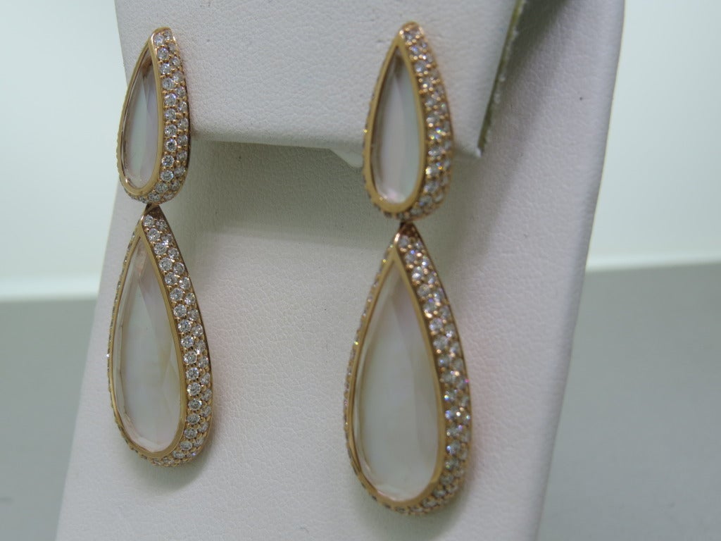 18k rose gold teardrop earrings with 3.06ctw diamonds and faceted crystal backed by mother of pearl. Earrings are 46mm x 15mm. Weight - 15.8g.