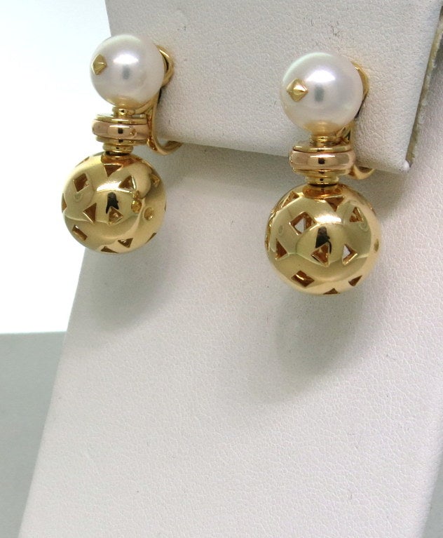 Bulgari 18k gold earrings with  9mm pearls from Aladdin collection. Earrings are 26mm long, gold ball is 12.5mm in diameter. Marked Bvlgari,750. weight 19.8g