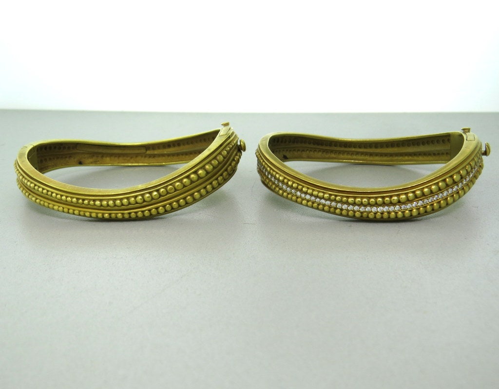 Set of two 18k gold wave Caviar bangle bracelets by Kieselstein-Cord. Bracelets will fit a 7