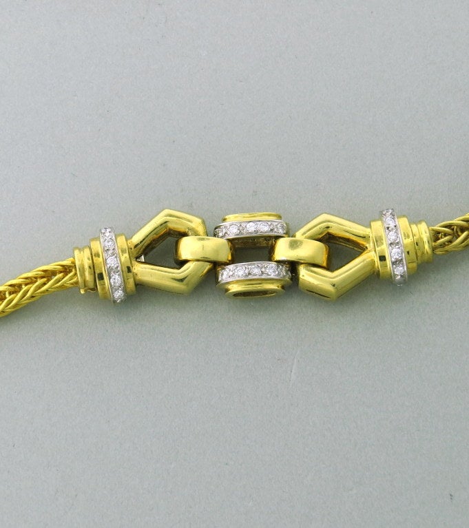 18k gold foxtail necklace with approximately 0.40 carats diamonds. Necklace is 28