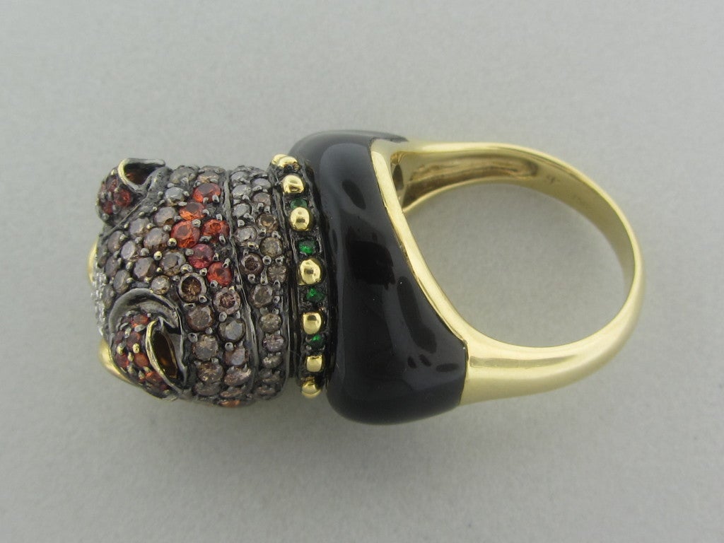 18K YELLOW GOLD,	NEDA BEHNAM HALLMARK, 750	DIAMONDS - approx. 0.12ctw
CHOCOLATE DIAMONDS - approx. 1.25
MULTI COLOR SAPPHIRES
GARNET
ONYX
	

Clarity: VS
Color: H
RING SIZE 8, RING SITS 20mm FROM FINGER (INCH = 25mm)
Weight:18.1g