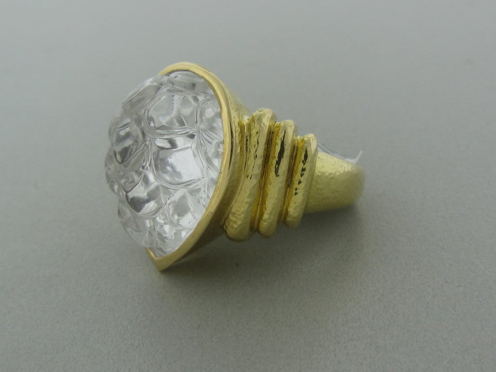 18K yellow gold Marked/Tested DAVID WEBB, 18K Gemstones/Diamonds Carved Rock Crystal Clarity: N/A Color: N/A Measurements: Ring size 6.25, top of ring 19mm X 20mm wide (inch= 25mm) Weight: 17.5g