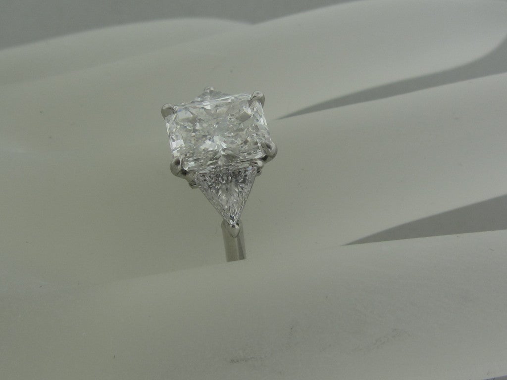 PLATINUM
	

MARKED/TESTED:
	TIFFANY & CO, PT950, 17606409, 2.09ct

DIAMONDS:CENTER DIAMOND CUT CORNERED RECTANGULAR MODIFIED BRILLIANT DIAMOND -  2.09ct (SEE CERTIFICATE PICTURES FOR ADDITIONAL INFORMATION)
SIDE DIAMONDS - 0.70ctw (G - H /