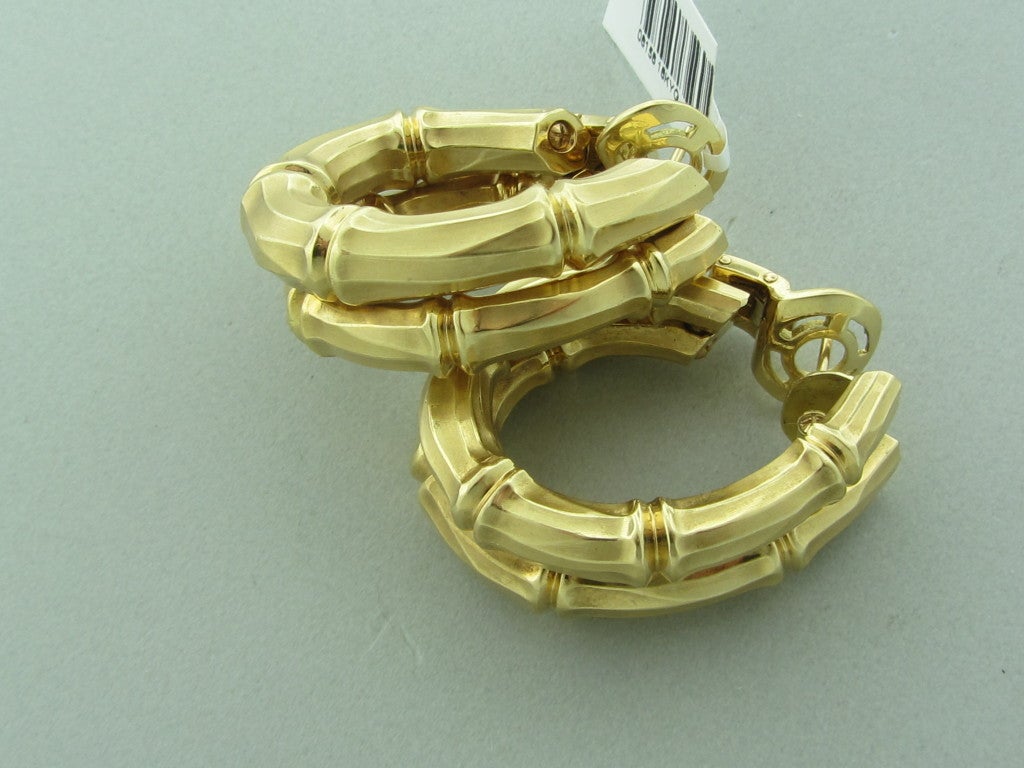18K Yellow Gold Gemstones/Diamonds:None Measurements:Earrings Are 34mm Long X 26mm Wide (Hoop) X 11.5mm (Inch=25mm) Marked/Tested:750,Cartier,657906. Clarity:n/a Color:n/a Weight:47.6g