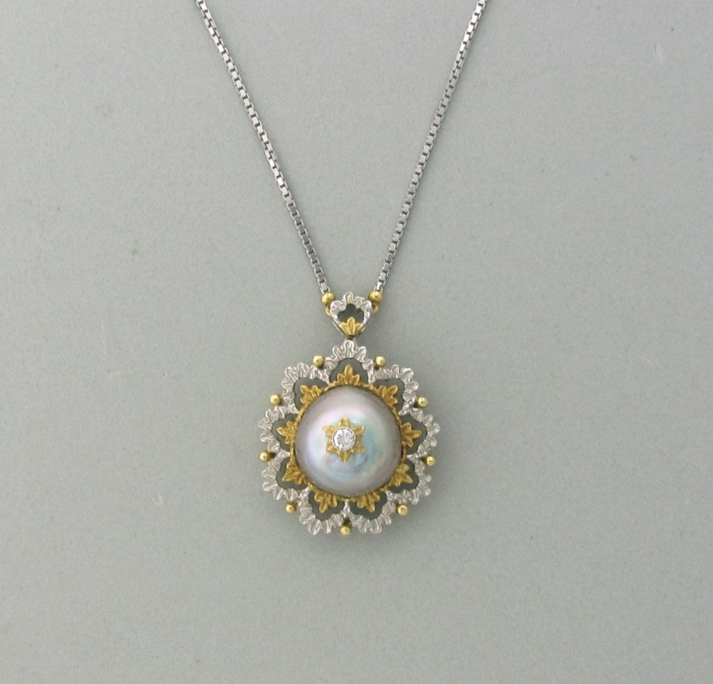 18K YELLOW AND WHITE GOLD	

DIAMOND - approx. 0.10ct

PEARL - 13.9mm X 13.8mm

 NECKLACE IS 15