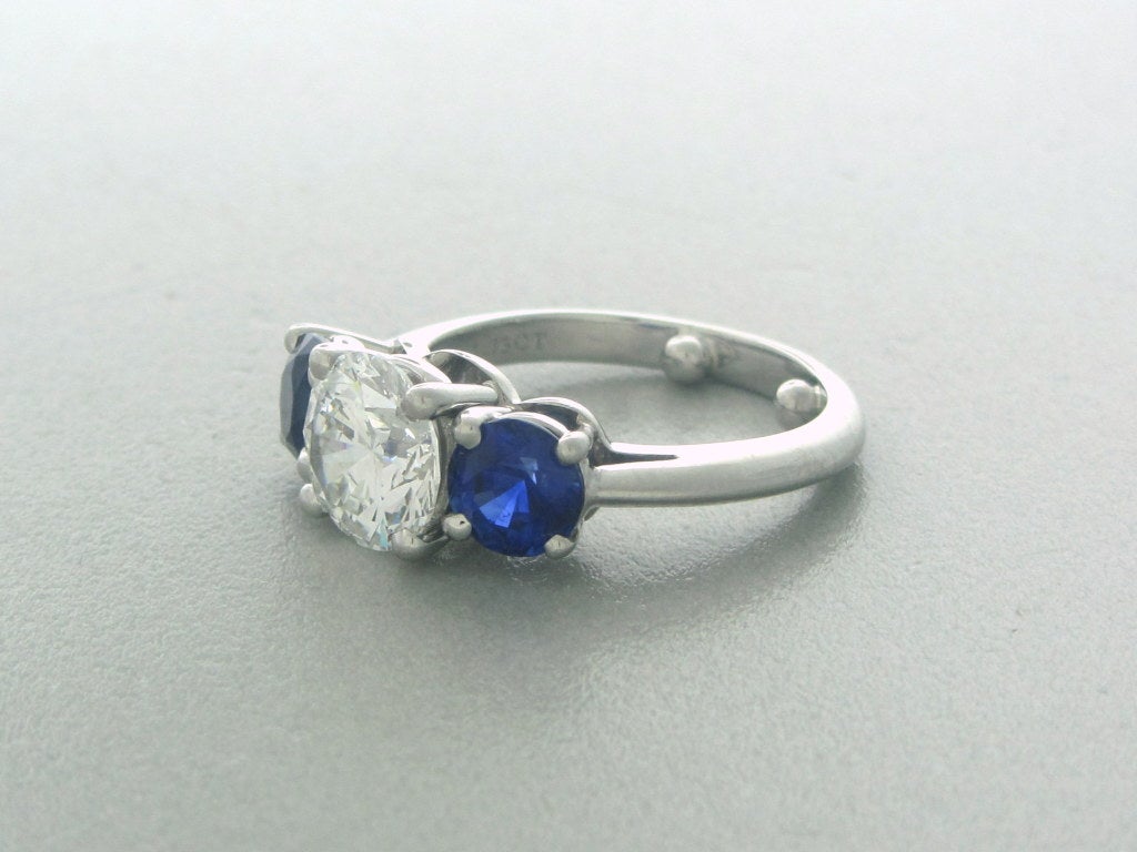 Tiffany & Co Platinum 1.73ct G/VS1 Diamond Triple Ex, Sapphire Engagement Ring.

DIAMOND - 1.73ct , SEE CERTIFICATE PICS FOR ADDITIONAL INFORMATION
SAPPHIRES - 1.88ctw
MEASUREMENTS 	RING SIZE 5.5
MARKED: TIFFANY & CO, PT950, 1.73ct,