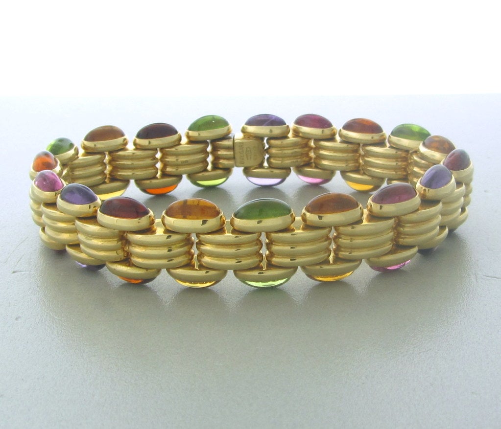 18K YELLOW  GOLD WITH MULTI COLOR CABOCHON GEMSTONES (PERIDOT, CITRINE, PINK TOURMALINE, AMETHYST, RHODOLITE)
THE BRACELET IS 7 1/2