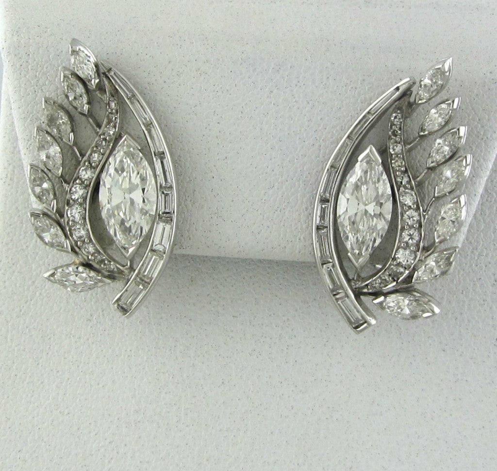 METAL 	PLATINUM WITH 18K WHITE GOLD BACKS
GEMSTONES/DIAMONDS 	MARQUIS DIAMONDS - 2.48ctw
SIDE DIAMONDS - 2.48ctw
SEE CERTIFICATE PICTURES FOR ADDITIONAL INFORMATION
MEASUREMENTS 	EARRINGS 30mm x 15mm ( 1 INCH = 25mm)
MARKED/TESTED 	PLATINUM /