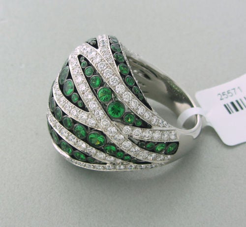Metal 	18k White Gold
Gemstones/diamonds 	Diamonds - Approx. 3.47ctw
Tsavorite - 2.98ctw
Measurements 	Ring Size - 6 1/4, Ring Top Is 25mm Wide (inch=25mm)
Marked/tested 	750, Asprey
Clarity 	Vs
Color 	G
Weight 	19.7 G