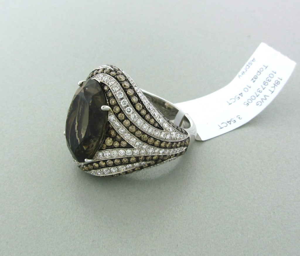 METAL 	18K WHITE GOLD
GEMSTONES/DIAMONDS 	WHITE AND BLACK DIAMONDS - 3.54ctw
SMOKEY TOPAZ - 10.45ct
MEASUREMENTS 	RING SIZE - 6 1/2
RING IS 23mm WIDE AND SITS 11mm OFF THE FINGER.
MARKED/TESTED 	ASPREY,750
CLARITY 	VVS/VS
COLOR 	F-G
WEIGHT
