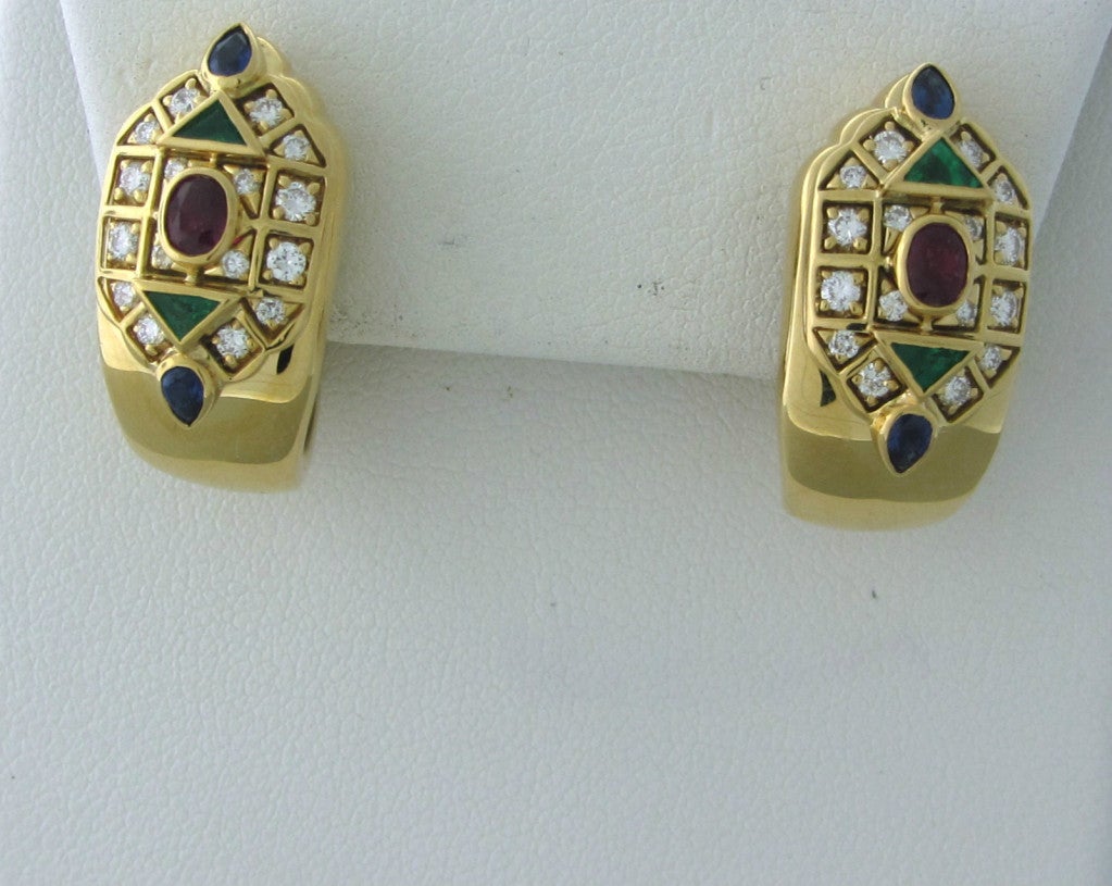 Metal 	18k Yellow Gold
Gemstones/diamonds 	Diamonds - Approx. 0.30ctw
Emeralds
Rubies
Sapphires
Measurements 	Earrings - 23mm X 11.5mm (1 Inch = 25mm)
Marked/tested 	Cartier, 750, 1994, C86519
Clarity 	VS
Color 	F-G
Weight 	20.1g
