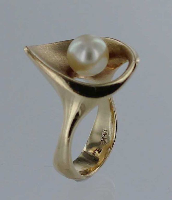 Circa 1950's 14-karat gold ring with pearl by American studio jeweler Ed Wiener.  The ring bears impressed marks and is in excellent condition.  The ring is size 7.25 and can be sized at no additional charge.