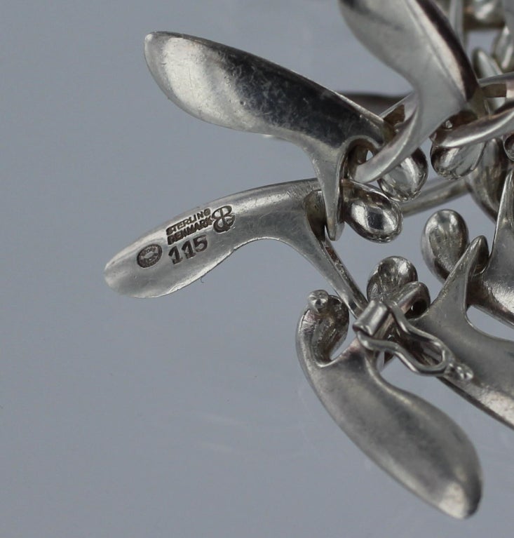 Georg Jensen sterling silver necklace No. 115 designed by Bent Gabrielsen in 1953.  This necklace measures 16.25 inches long and the links are 1-inch long.  The necklace is in excellent condition and bears impressed company marks for Georg Jensen,