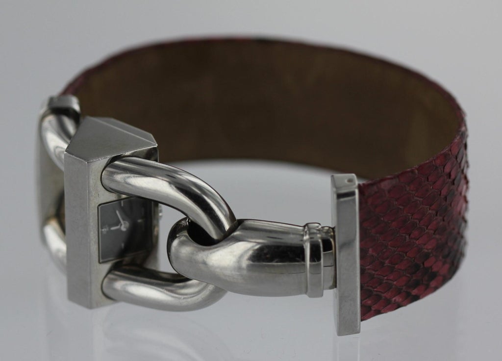 Van Cleef & Arpels stainless steel Cadendas, or padlock, wristwatch with crocodile band. Band measures approximately 1 inch wide and 6 inches long. The watch is numbered 135572 and in excellent condition.