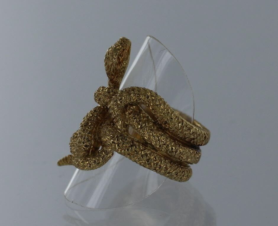BUCCELLATI Gold Snake Ring in 18 karat yellow gold. This sculptural snake ring is exquisitely detailed giving it life-like texture.  The ring is size 6.5 (NOTE: Can be resized).  The ring bears impressed company marks and is in excellent condition.