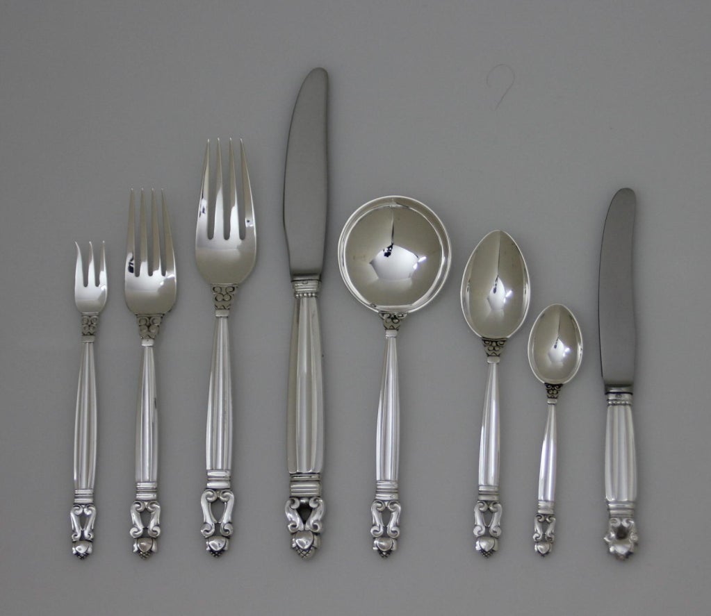 GEORG JENSEN Acorn sterling silver flatware, featuring an eight-piece place setting with service for Twelve.  The Acorn pattern was designed by Johan Rohde in 1915. This service consists of the following individual pieces: Long handle dinner knife