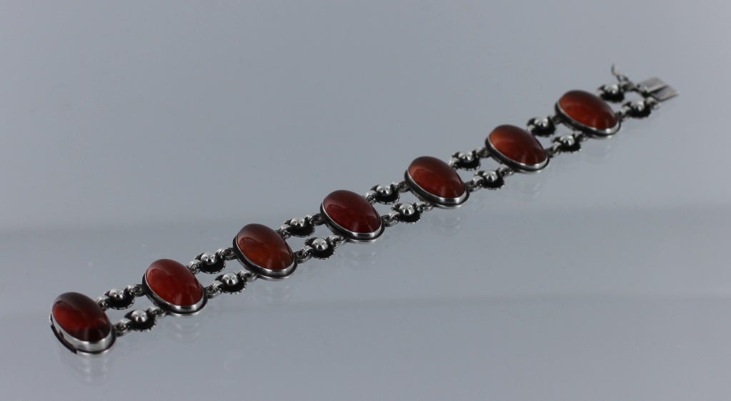 Georg Jensen bracelet No. 63 with Carnelian. This bracelet was designed by Henry Pilstrup in 1935.  This bracelet bears production marks for 1930's. The bracelet measures approximately 7 1/4